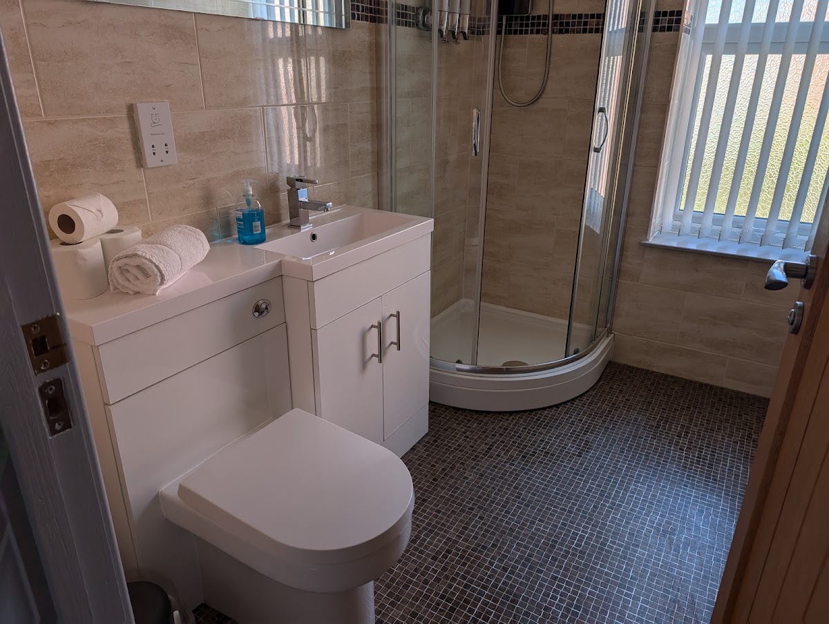 A sparkling clean bathroom with fresh towels
